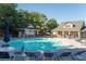 Community pool with ample seating, clubhouse, and well-maintained landscaping at 4206 Mastic Pt # 24, Acworth, GA 30101