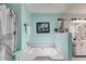 Relaxing bathroom features a soaking tub, light blue walls, and nautical decorations at 1876 Kathy Ct, Douglasville, GA 30135