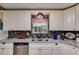 Updated kitchen featuring granite countertops, stainless steel appliances, and ample storage space at 1876 Kathy Ct, Douglasville, GA 30135