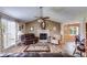 Spacious living room boasts vaulted ceilings, fireplace, and seamless flow to dining area at 1876 Kathy Ct, Douglasville, GA 30135