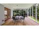 Screened-in porch is perfect for enjoying the outdoors with seating and natural light at 1876 Kathy Ct, Douglasville, GA 30135