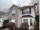 Charming two-story home featuring stone accents, vinyl siding, updated windows, and a well-maintained front yard at 2917 Duncan Pl, Decatur, GA 30034