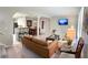 Open-concept living area with modern furniture, a TV, and seamless connectivity to the dining and kitchen spaces at 2917 Duncan Pl, Decatur, GA 30034