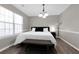 Inviting bedroom with a large window, queen-sized bed, hardwood floors, and stylish modern decor at 2917 Duncan Pl, Decatur, GA 30034