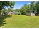 Lush backyard with plenty of green space and mature trees, creating a serene outdoor oasis at 3690 Lithia Way, Lithia Springs, GA 30122