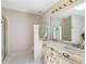 Bathroom with double sinks and vanities, tiled floor and walk-in shower at 3690 Lithia Way, Lithia Springs, GA 30122