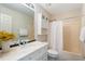 Cozy bathroom featuring a shower-tub combo, white vanity, and storage, creating a clean and functional space at 3690 Lithia Way, Lithia Springs, GA 30122