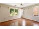 Inviting bedroom filled with natural light, features wood-look floors and a view of the outdoors at 3690 Lithia Way, Lithia Springs, GA 30122