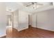 Bedroom with hardwood floors, ceiling fan, and doors to hallway and bathroom at 3690 Lithia Way, Lithia Springs, GA 30122