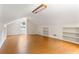 Bright bonus room with hardwood floors, built-in shelves, and a window for natural light at 3690 Lithia Way, Lithia Springs, GA 30122