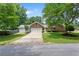 Ranch style brick home with attached garage and manicured landscaping, in established neighborhood at 3690 Lithia Way, Lithia Springs, GA 30122