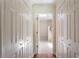 Hallway showing closets with view through open door to a laundry area at 3690 Lithia Way, Lithia Springs, GA 30122