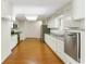 Bright kitchen features stainless steel appliances, granite countertops and hardwood floors at 3690 Lithia Way, Lithia Springs, GA 30122