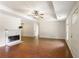 Open-concept living room features hardwood floors, fireplace, and stylish decor at 3690 Lithia Way, Lithia Springs, GA 30122