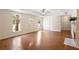 Bright living room features hardwood floors, trey ceiling, fireplace, and arched windows at 3690 Lithia Way, Lithia Springs, GA 30122