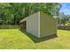 Backyard shed with access doors offers ample storage for outdoor equipment and tools at 3690 Lithia Way, Lithia Springs, GA 30122