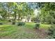 The lush backyard offers mature trees, foliage, and a serene setting at 4095 Indian Creek Cir, Stone Mountain, GA 30083