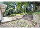 The backyard offers stone steps and patio areas at 4095 Indian Creek Cir, Stone Mountain, GA 30083