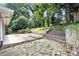 The backyard offers stone steps and patio areas at 4095 Indian Creek Cir, Stone Mountain, GA 30083