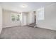 Spacious basement area with neutral colored walls, plush carpeting, and ample lighting at 4095 Indian Creek Cir, Stone Mountain, GA 30083