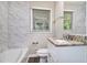 Bathroom featuring granite countertops, tiled walls, and a shower/tub combo at 4095 Indian Creek Cir, Stone Mountain, GA 30083