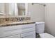 Bathroom with white vanity, granite countertop, updated fixtures, and great natural light at 4095 Indian Creek Cir, Stone Mountain, GA 30083