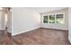 Bright bedroom with new wood flooring and large windows overlooking the yard at 4095 Indian Creek Cir, Stone Mountain, GA 30083