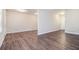 Open-concept living area with neutral walls, dark wood-look floors, and abundant natural light at 4095 Indian Creek Cir, Stone Mountain, GA 30083