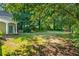 Expansive backyard with lush trees, providing a private outdoor space and ample room for recreation at 5271 Oglethorpe Ct, Powder Springs, GA 30127