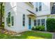 Home featuring a bright turquoise front door, complemented by lush green grass at 5271 Oglethorpe Ct, Powder Springs, GA 30127