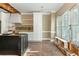 View of a bright kitchen with new cabinets and hardwood floors at 5271 Oglethorpe Ct, Powder Springs, GA 30127