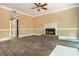 Unfinished living room featuring new floors, a fireplace, and a blank canvas for renovation at 5271 Oglethorpe Ct, Powder Springs, GA 30127