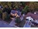 Aerial view showcases a beautiful home surrounded by mature trees and landscape at 1784 Virginia Grove Ln, Lawrenceville, GA 30045