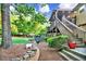 The backyard features a stone pathway and patio area ideal for outdoor living at 1784 Virginia Grove Ln, Lawrenceville, GA 30045