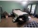 This bedroom boasts a ceiling fan, a large window, and a neutral paint color at 1784 Virginia Grove Ln, Lawrenceville, GA 30045