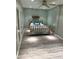 Well-lit bedroom with a ceiling fan and modern gray walls, providing a calm and inviting atmosphere at 1784 Virginia Grove Ln, Lawrenceville, GA 30045