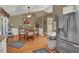 Inviting dining area featuring wood floors, table with seating, and a stylish ceiling fan at 1784 Virginia Grove Ln, Lawrenceville, GA 30045