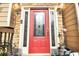 Beautiful red front door with glass insets flanked by sidelights at 1784 Virginia Grove Ln, Lawrenceville, GA 30045