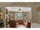 Cozy living room with a fireplace, comfortable seating, and a large window at 1784 Virginia Grove Ln, Lawrenceville, GA 30045