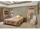 Bedroom with a tray ceiling, decorative accents, and a comfortable bed at 1784 Virginia Grove Ln, Lawrenceville, GA 30045