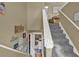 View of the carpeted staircase with white handrail at 1784 Virginia Grove Ln, Lawrenceville, GA 30045