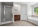 Bathroom featuring shower, separate soaking tub and vanity at 1786 Jameson Cir, Lawrenceville, GA 30043