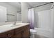 Bathroom with vanity, mirror, and shower-tub combination at 1786 Jameson Cir, Lawrenceville, GA 30043