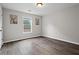 Empty bedroom with two paintings and bright natural light at 1786 Jameson Cir, Lawrenceville, GA 30043