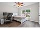 Bedroom features natural light, ceiling fan and desk at 1786 Jameson Cir, Lawrenceville, GA 30043