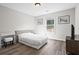 Bedroom with bright natural light, wood floors and furniture at 1786 Jameson Cir, Lawrenceville, GA 30043