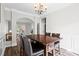 Comfortable dining area with seating for four, an elegant chandelier, and access to the office at 1786 Jameson Cir, Lawrenceville, GA 30043