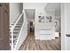 Inviting foyer with hardwood floors, staircase, neutral paint, and access to the kitchen at 1786 Jameson Cir, Lawrenceville, GA 30043