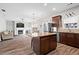 Open-concept living space features modern lighting, granite countertops, stainless steel appliances, and fireplace at 1786 Jameson Cir, Lawrenceville, GA 30043