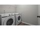 Modern laundry room with Samsung washer and dryer set at 1786 Jameson Cir, Lawrenceville, GA 30043